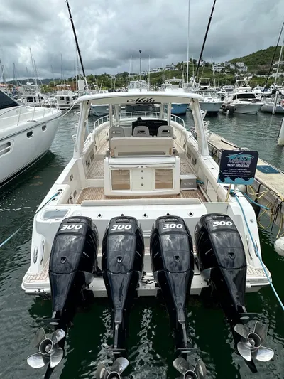  Yacht Photos Pics 2015 Boston Whaler 420 Outrage with four 300 HP engines docked at marina.
