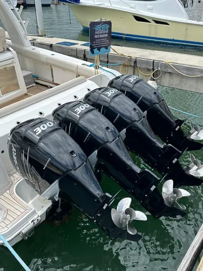  Yacht Photos Pics 2015 Boston Whaler 420 Outrage with four powerful outboard engines docked at marina.