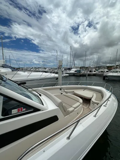  Yacht Photos Pics 2015 Boston Whaler 420 Outrage docked at marina under cloudy sky.