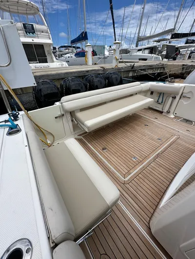 Yacht Photos Pics 2015 Boston Whaler 420 Outrage boat with spacious deck and seating at marina.