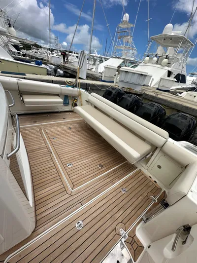  Yacht Photos Pics 2015 Boston Whaler 420 Outrage boat with teak deck and seating, docked at marina.