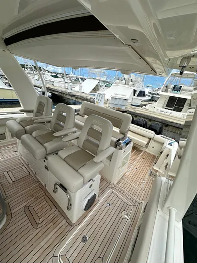  Yacht Photos Pics 2015 Boston Whaler 420 Outrage boat interior with luxurious seating at marina.