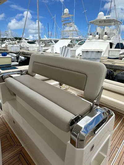  Yacht Photos Pics Boston Whaler 420 Outrage 2015 boat seating area with marina background.