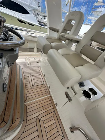  Yacht Photos Pics 2015 Boston Whaler 420 Outrage interior with luxurious seating and teak flooring.