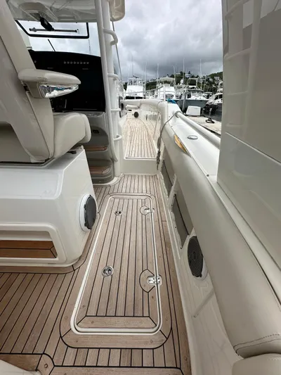  Yacht Photos Pics 2015 Boston Whaler 420 Outrage boat interior with teak flooring and seating.