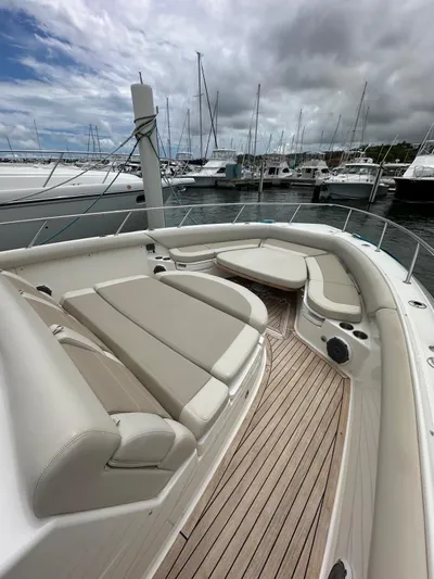  Yacht Photos Pics 2015 Boston Whaler 420 Outrage boat with spacious deck and seating, docked at marina.
