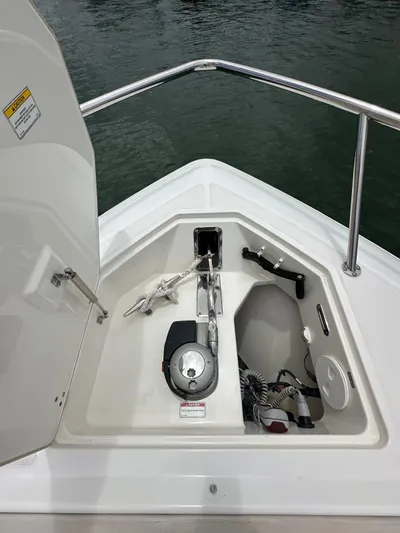  Yacht Photos Pics 2015 Boston Whaler 420 Outrage anchor compartment with equipment and storage.
