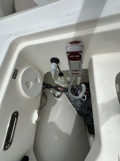  Yacht Photos Pics 2015 Boston Whaler 420 Outrage boat interior with radio and storage compartment.