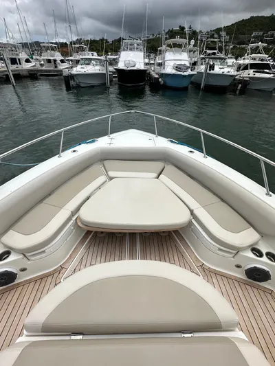  Yacht Photos Pics 2015 Boston Whaler 420 Outrage boat docked, featuring spacious seating and sleek design.