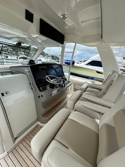  Yacht Photos Pics 2015 Boston Whaler 420 Outrage interior with luxurious seating and modern helm controls.