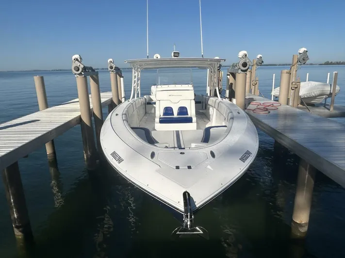  Yacht Photos Pics 2016 Midnight Express 37 Open boat docked at a marina, clear blue sky.
