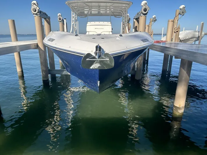  Yacht Photos Pics 2016 Midnight Express 37 Open boat docked on clear water.