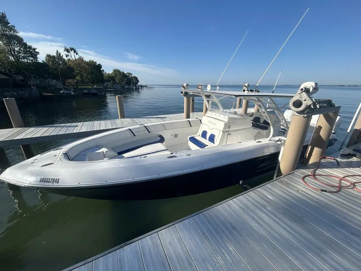  Yacht Photos Pics 2016 Midnight Express 37 Open boat docked by a serene waterfront.