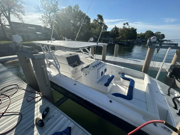  Yacht Photos Pics 2016 Midnight Express 37 Open boat docked at marina, featuring sleek design and spacious seating.