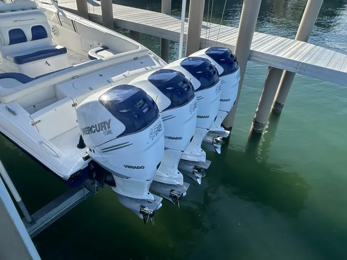  Yacht Photos Pics 2016 Midnight Express 37 Open boat with four Mercury Verado outboard engines docked.