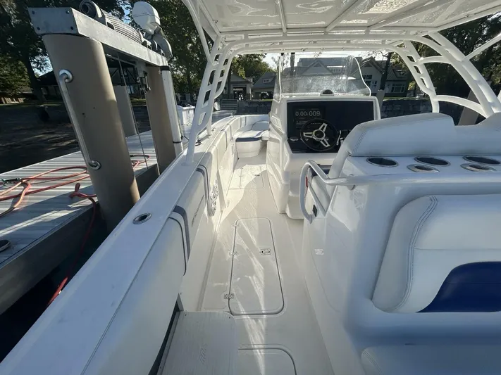  Yacht Photos Pics 2016 Midnight Express 37 Open boat interior with helm and seating, docked at marina.