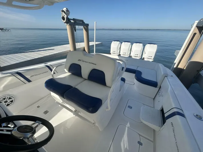 Yacht Photos Pics 2016 Midnight Express 37 Open boat with sleek seating and powerful engines by the dock.