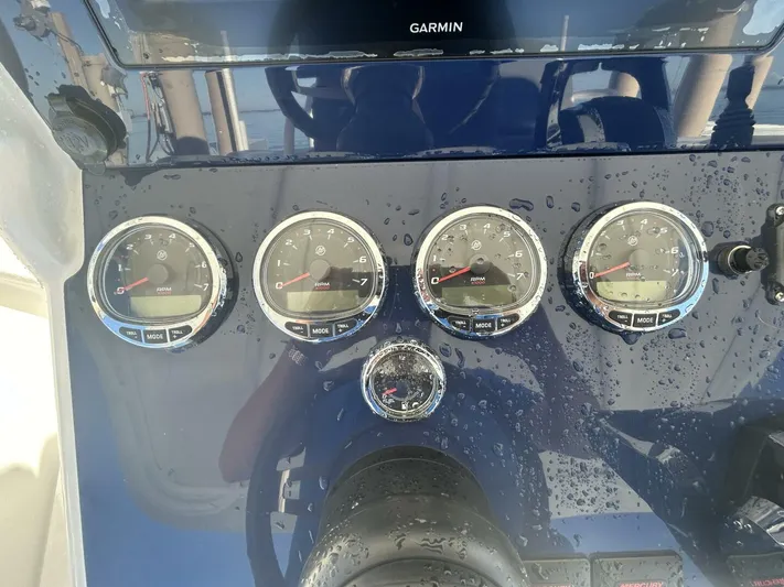  Yacht Photos Pics Dashboard of a 2016 Midnight Express 37 Open boat with gauges and Garmin display.