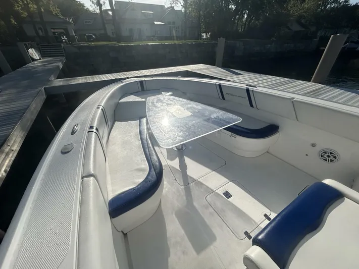  Yacht Photos Pics 2016 Midnight Express 37 Open boat with spacious seating and sleek design at dock.