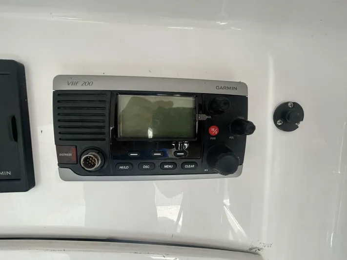  Yacht Photos Pics Garmin VHF 200 radio on 2016 Midnight Express 37 Open boat dashboard.