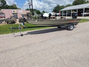 2025 Tracker Grizzly 15 Jon boat on trailer, parked outdoors near dealership.