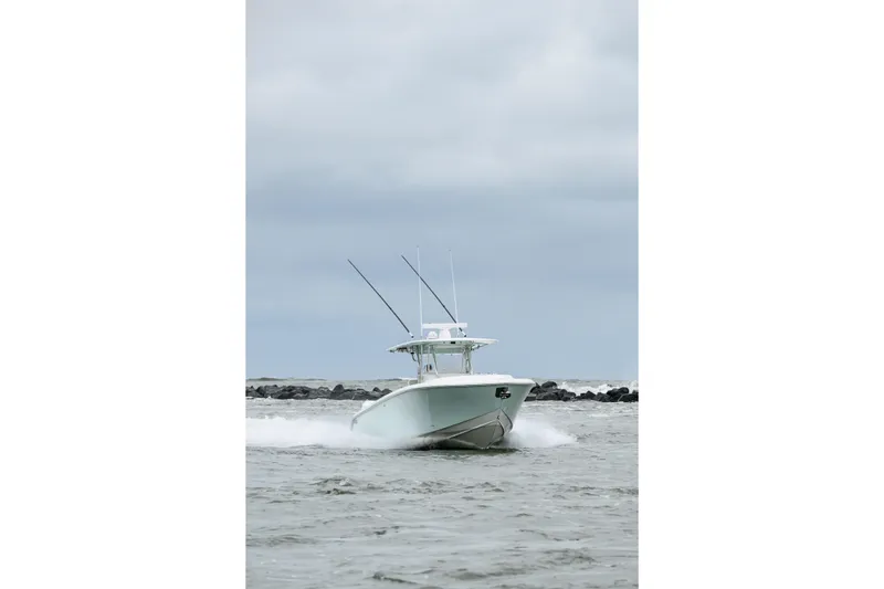 Comeback Yacht Photos Pics 2008 Venture 39 Cuddy boat navigating through choppy waters under cloudy skies.