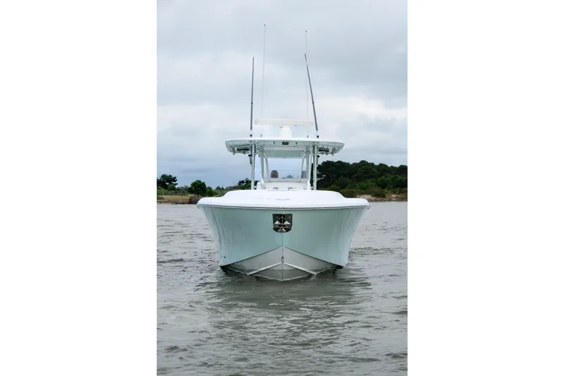 Comeback Yacht Photos Pics 2008 Venture 39 Cuddy boat on water, front view, overcast sky.