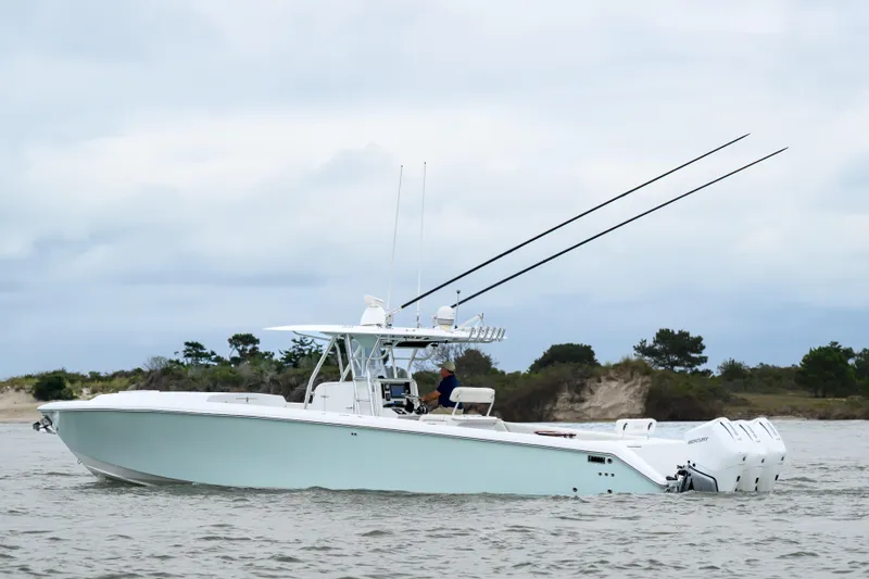 Comeback Yacht Photos Pics 2008 Venture 39 Cuddy boat on water, featuring sleek design and powerful engines.