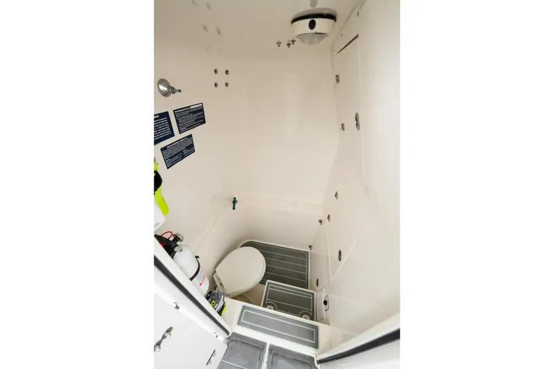 Comeback Yacht Photos Pics 2008 Venture 39 Cuddy boat interior with compact bathroom and toilet.