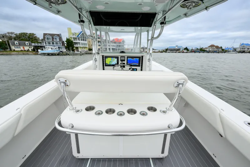 Comeback Yacht Photos Pics 2008 Venture 39 Cuddy boat interior with helm, cup holders, and waterfront view.