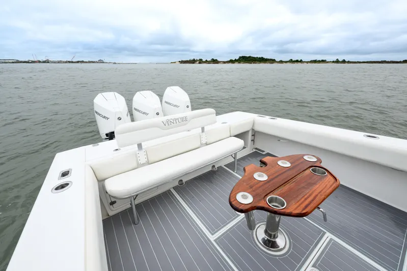 Comeback Yacht Photos Pics 2008 Venture 39 Cuddy boat with triple Mercury engines, spacious deck, and elegant seating.