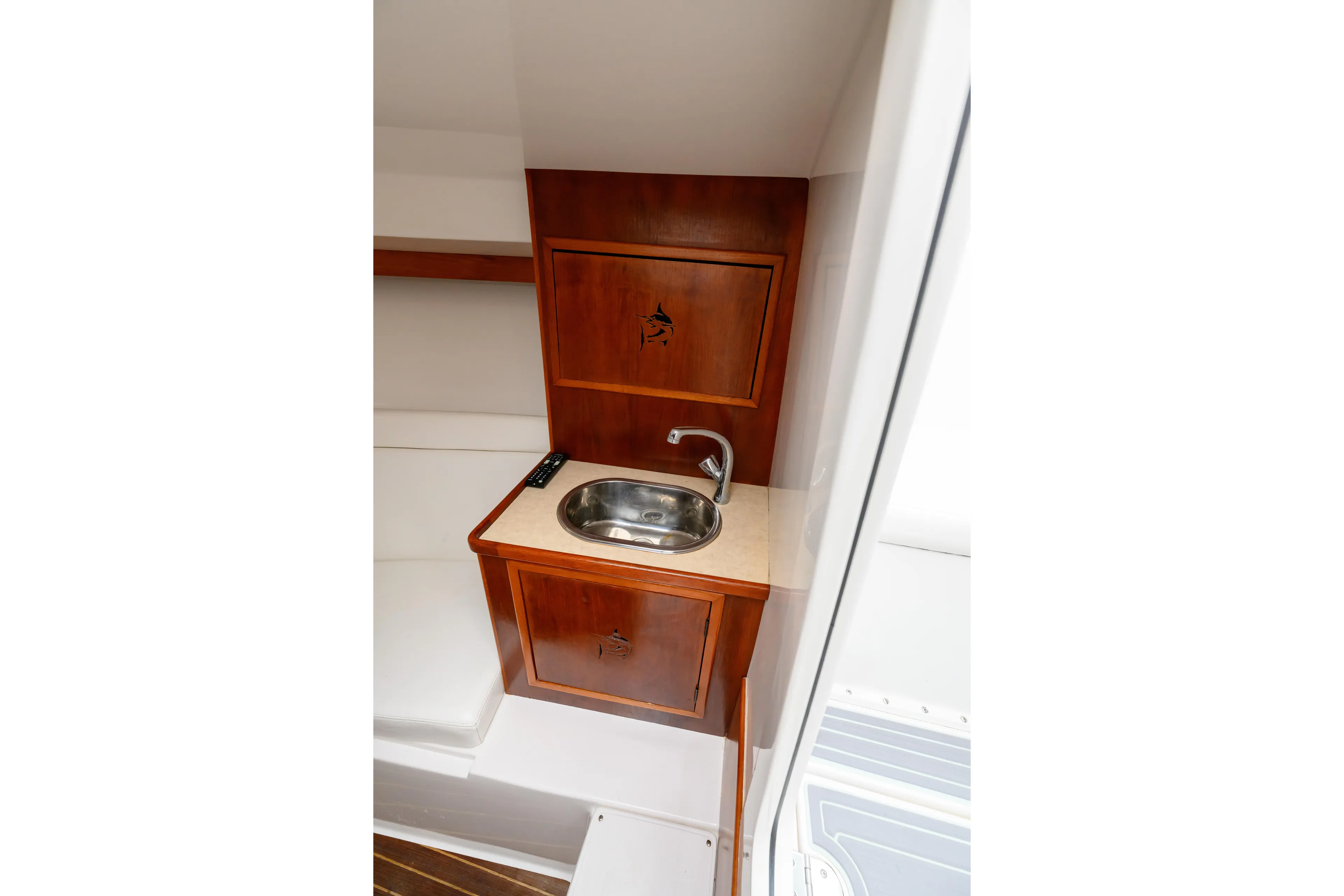 Comeback Yacht Photos Pics 2008 Venture 39 Cuddy interior with wooden cabinetry and compact sink.