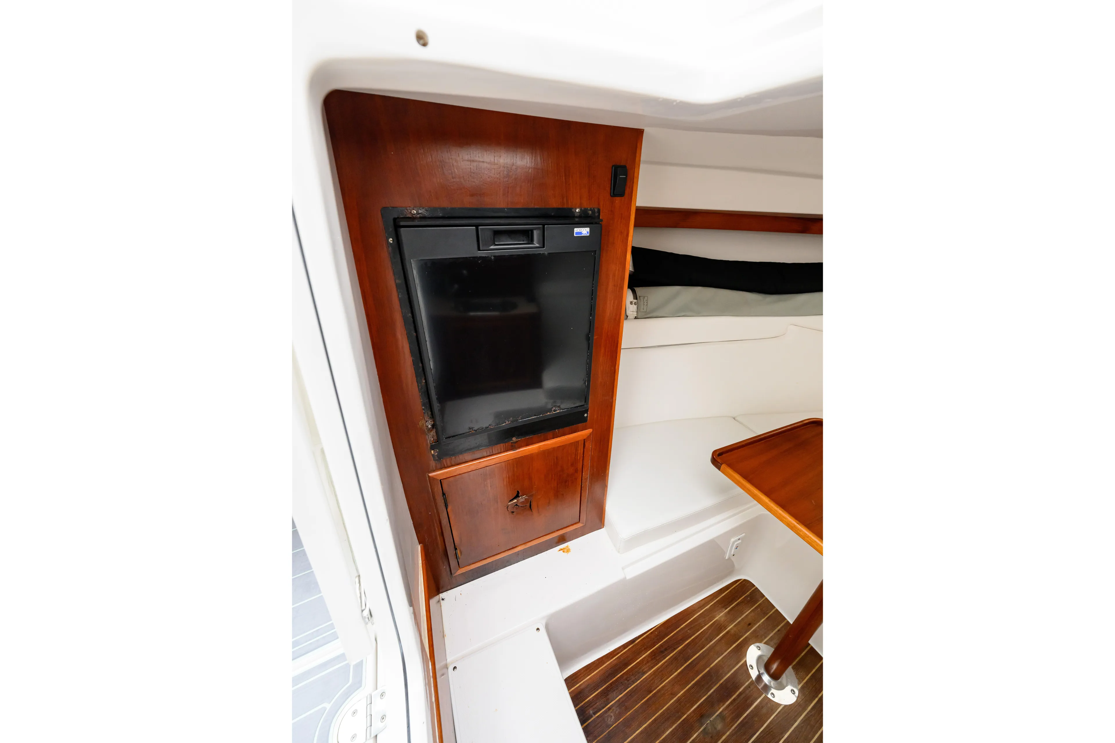 Comeback Yacht Photos Pics 2008 Venture 39 Cuddy cabin interior with wood paneling and compact fridge.