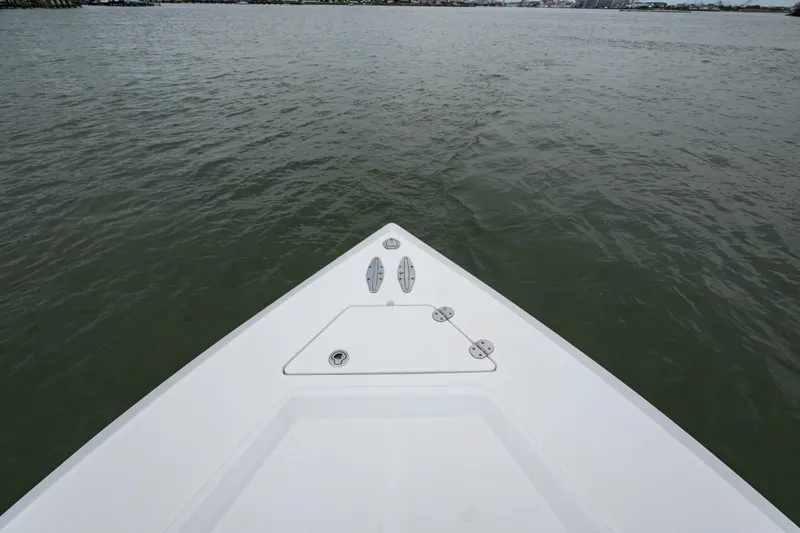Comeback Yacht Photos Pics Bow view of 2008 Venture 39 Cuddy boat on calm water.