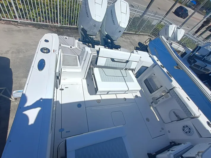  Yacht Photos Pics 2025 Blackfin 302 DC boat deck with seating and dual Mercury engines.