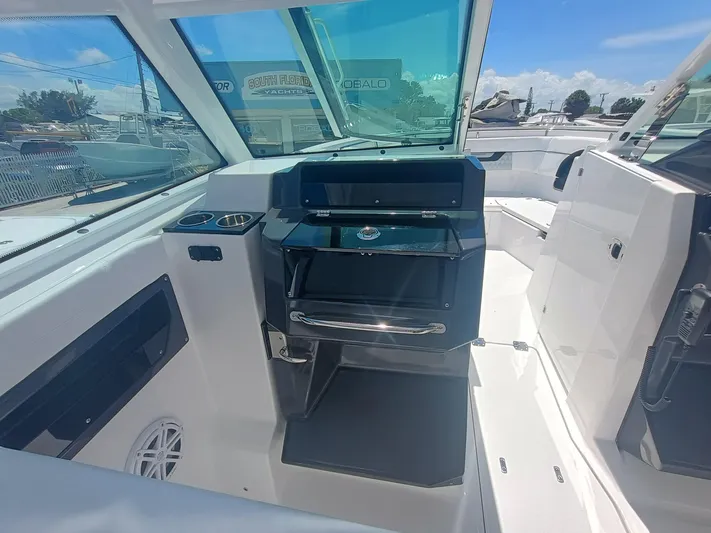  Yacht Photos Pics 2025 Blackfin 302 DC boat interior with sleek dashboard and modern design.