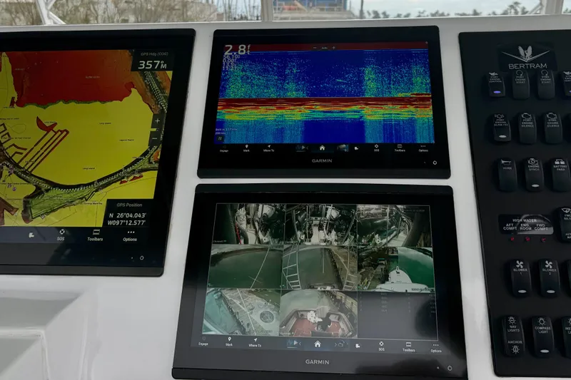 Pura Vida Yacht Photos Pics Control panel of a 1985 Bertram 54 Convertible with Garmin navigation displays.