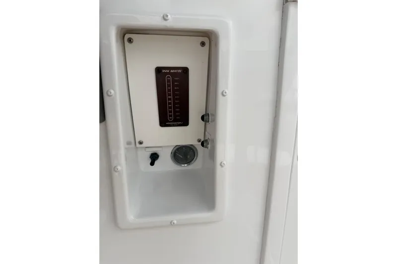 Pura Vida Yacht Photos Pics Control panel on a 1985 Bertram 54 Convertible boat, featuring a tank level indicator.