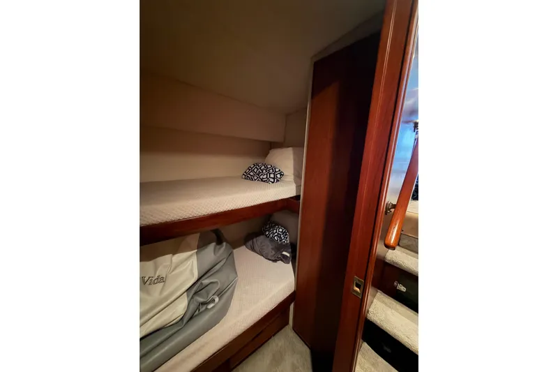 Pura Vida Yacht Photos Pics Cozy bunk beds in 1985 Bertram 54 Convertible yacht cabin.
