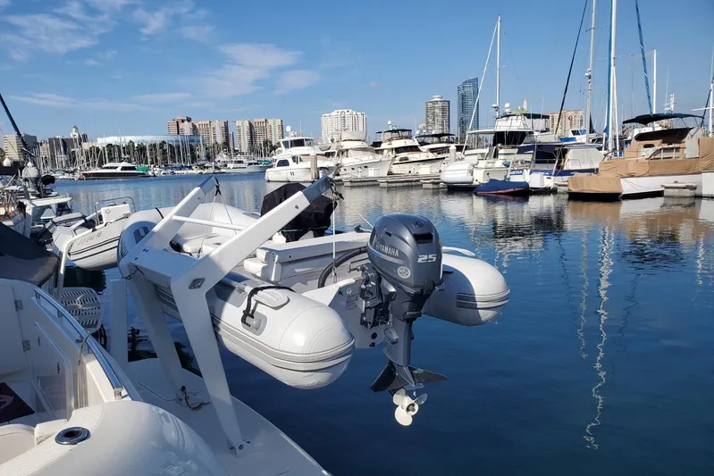 Embracing Life Yacht Photos Pics 2004 Meridian 459 Motoryacht docked in a marina with city skyline.
