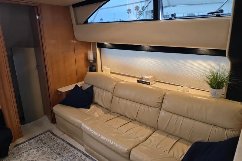Embracing Life Yacht Photos Pics Luxurious interior of 2004 Meridian 459 Motoryacht with leather sofa and elegant decor.