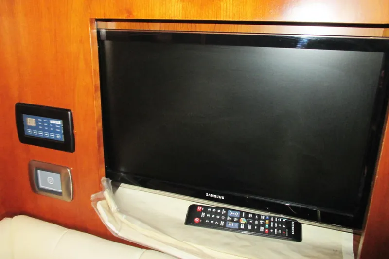 Manon Yacht Photos Pics Samsung TV and control panel inside 2008 Mano Marine 38.50 yacht cabin.