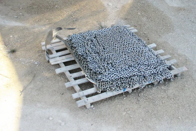 Manon Yacht Photos Pics Heavy metal chains and anchor on wooden pallet, Mano Marine 38.50, 2008.