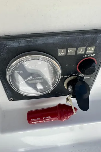 Pacifico Yacht Photos Pics Control panel of a 2005 Beneteau First 44.7 sailboat with key and gauge.