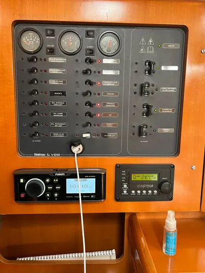 Pacifico Yacht Photos Pics Control panel of a 2005 Beneteau First 44.7 sailboat with various switches and gauges.
