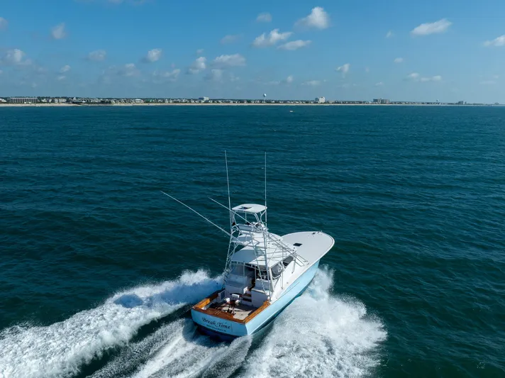Break Time Yacht Photos Pics 2007 Custom Carolina Layton Express boat cruising on open sea under clear blue sky.