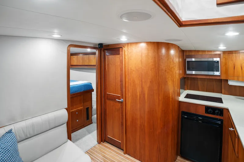 Break Time Yacht Photos Pics Interior of 2007 Custom Carolina Layton Express yacht with wood finish and modern amenities.