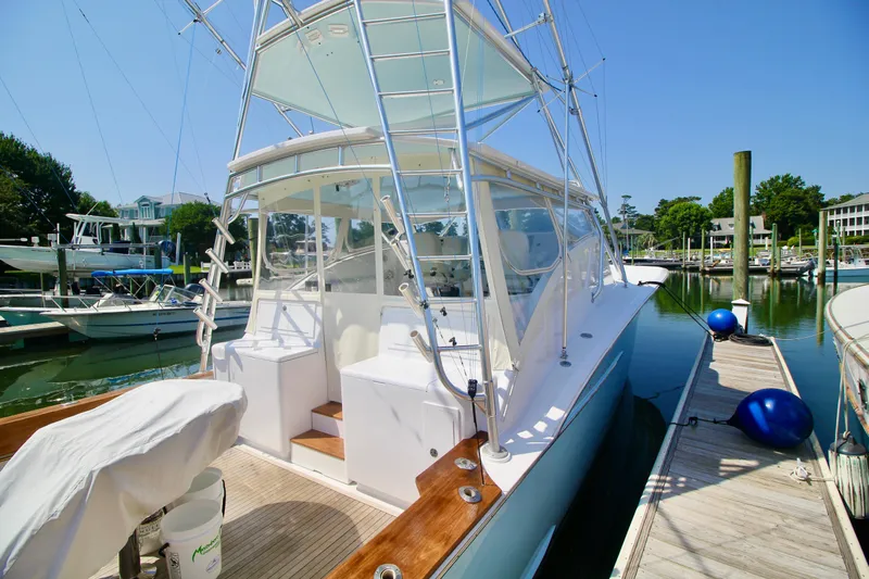 Break Time Yacht Photos Pics 2007 Custom Carolina Layton Express boat docked at marina under clear blue sky.