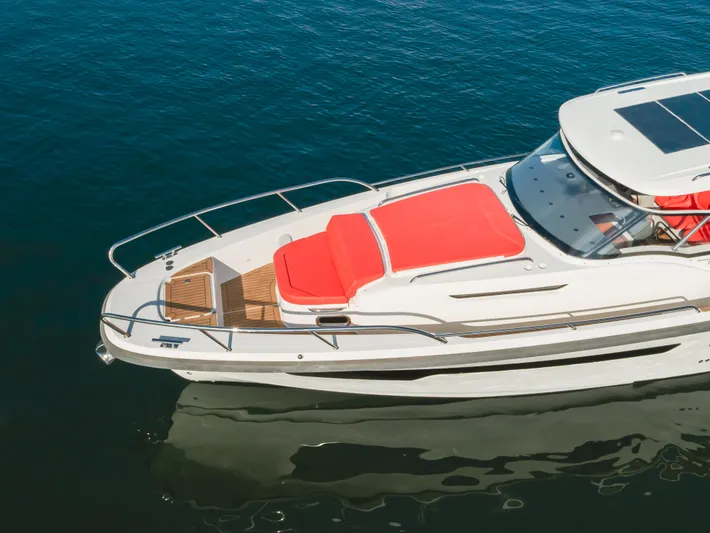 Intrepid Yacht Photos Pics Luxury Nimbus T11 2021 yacht with red sunbeds on calm blue water.