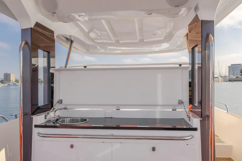 Intrepid Yacht Photos Pics Outdoor kitchen on a 2021 Nimbus T11 yacht with sink and countertop.